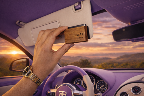BYZK Lavender No.03 wooden car air freshener mounted on sun visor inside a Bugatti with lavender, cream, and ecru interior during golden hour